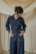 Navy Floral Embroidered Co-Ord Set — three-quarter view, textured navy button-up top and wide-leg trouser with floral embroidery