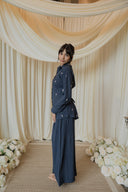 Navy Floral Embroidered Co-Ord Set — kimono-style navy top and wide-leg trouser, styled with floral décor backdrop