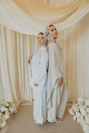 Sage Green Cape Co-Ord Set — back-to-back pose with a matching pastel look, cape flowing to the floor