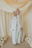 Sage Green Cape Co-Ord Set — standing side-by-side pose, styled alongside a matching pastel look