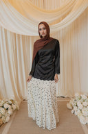 Black Satin Shirt with Wavy Embroidered Hem styled with White Chiffon Skirt with Black Floral Print — full-body centered view