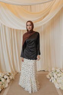 Black Satin Shirt with Wavy Embroidered Hem styled with White Chiffon Skirt with Black Floral Print — standing front view