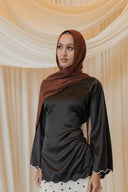Black Satin Shirt with Wavy Embroidered Hem styled with White Chiffon Skirt with Black Floral Print — front view showing wavy embroidered hemline